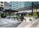 Inviting outdoor seating area with umbrellas and lush greenery for relaxing at 145 15Th Ne St # 1225, Atlanta, GA 30309