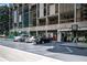 View of ground-level parking in front of restaurants at Colony Square at 145 15Th Ne St # 1225, Atlanta, GA 30309