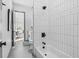 Clean white bathroom featuring subway tile and contrasting dark fixtures at 3378 Bachelor St, Atlanta, GA 30344