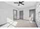 Neutral bedroom featuring ceiling fan, recessed lights, and ensuite bathroom at 3378 Bachelor St, Atlanta, GA 30344