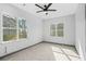 Bright bedroom with large windows and a modern ceiling fan at 3378 Bachelor St, Atlanta, GA 30344