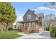 Charming two-story home features a welcoming front porch, manicured lawn, and a modern gray exterior at 3378 Bachelor St, Atlanta, GA 30344