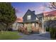 Charming two-story home features a welcoming front porch, manicured lawn, and a modern gray exterior at 3378 Bachelor St, Atlanta, GA 30344