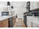 Modern kitchen with stainless appliances, granite countertops and black backsplash at 3378 Bachelor St, Atlanta, GA 30344