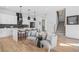 Open plan living area with kitchen island, seating area, and staircase at 3378 Bachelor St, Atlanta, GA 30344