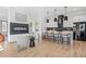 Open-concept living space with modern kitchen, fireplace, and stylish seating for seamless entertaining at 3378 Bachelor St, Atlanta, GA 30344