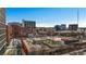 Aerial view of community rooftop with city views, featuring a playground and ample green space at 650 Glen Iris Drive Ne # 27, Atlanta, GA 30308