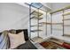 Spacious walk-in closet with a seating area and custom adjustable metal shelving units at 650 Glen Iris Drive Ne # 27, Atlanta, GA 30308