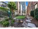 This dog park has rocks, mulch, greenery, and artificial turf at 650 Glen Iris Drive Ne # 27, Atlanta, GA 30308