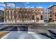 Brick building exterior with architectural details, large windows, and street view at 650 Glen Iris Drive Ne # 27, Atlanta, GA 30308