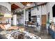 Open concept living space with modern decor, brick accents, and exposed beams at 650 Glen Iris Drive Ne # 27, Atlanta, GA 30308