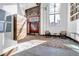 Bright lobby entrance featuring double doors, a brick wall, modern chandelier, chairs and mosaic flooring at 650 Glen Iris Drive Ne # 27, Atlanta, GA 30308