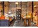 Charming exposed brick office featuring a modern desk, shelving and a comfortable sitting area at 650 Glen Iris Drive Ne # 27, Atlanta, GA 30308