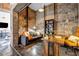 Charming exposed brick office featuring a modern desk, shelving and a comfortable sitting area at 650 Glen Iris Drive Ne # 27, Atlanta, GA 30308