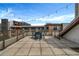 Expansive rooftop deck perfect for entertaining with string lights and outdoor dining furniture at 650 Glen Iris Drive Ne # 27, Atlanta, GA 30308
