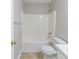A clean bathroom featuring a shower and tub at 7623 Mcgillicuty Dr, Union City, GA 30291