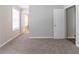 A bedroom with plush carpeting and a bright window at 7623 Mcgillicuty Dr, Union City, GA 30291