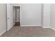 A spacious bedroom with plush carpeting at 7623 Mcgillicuty Dr, Union City, GA 30291