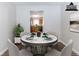 Cozy dining area with seating for four, adjacent to the kitchen space at 7623 Mcgillicuty Dr, Union City, GA 30291