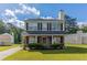 Charming two-story home features a classic design and well-maintained front yard at 7623 Mcgillicuty Dr, Union City, GA 30291