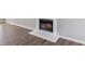 Living room fireplace with white mantle and hearth at 7623 Mcgillicuty Dr, Union City, GA 30291