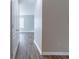 Neutral hallway with wood-look flooring at 7623 Mcgillicuty Dr, Union City, GA 30291