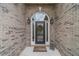 Close-up of the front door showcasing sidelights, decorative wreath, and brick facade at 1657 Williams Mill Way, Dacula, GA 30019