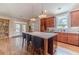 Stylish kitchen with a large island, wood cabinets, and stainless steel appliances at 1657 Williams Mill Way, Dacula, GA 30019