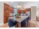 Bright kitchen featuring a large island with seating, stainless steel appliances, and wood cabinets at 1657 Williams Mill Way, Dacula, GA 30019