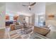 Spacious living room featuring hardwood floors, neutral decor, fireplace, and arched doorway at 1657 Williams Mill Way, Dacula, GA 30019