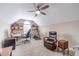 Attic room used as a home office with lots of natural light, desk, and comfortable leather chair at 1657 Williams Mill Way, Dacula, GA 30019