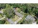 An aerial view of the home and surrounding neighborhood surrounded by mature trees at 1890 Silvastone Dr, Decatur, GA 30033