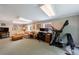 Finished basement with carpet, couch, desk, exercise equipment and TV at 1890 Silvastone Dr, Decatur, GA 30033