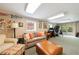 Finished basement featuring carpet, couch, desk, and french doors leading to the backyard at 1890 Silvastone Dr, Decatur, GA 30033