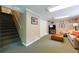 Finished basement with carpet, a couch, TV, and storage at 1890 Silvastone Dr, Decatur, GA 30033