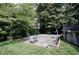 Outdoor basketball court surrounded by lush greenery for recreational activities at 1890 Silvastone Dr, Decatur, GA 30033