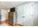 Bedroom featuring hardwood floors, a dresser, and a closet with white doors at 1890 Silvastone Dr, Decatur, GA 30033