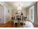 Elegant dining room with hardwood floors, stylish lighting, and comfortable seating for formal gatherings at 1890 Silvastone Dr, Decatur, GA 30033