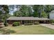 Inviting single-story home with a well-maintained yard and traditional design at 1890 Silvastone Dr, Decatur, GA 30033