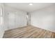 Bedroom boasts wood-look floors, a window, and a closet, offering ample storage and natural light at 2376 Cross Nw St, Atlanta, GA 30318