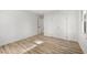 Light-filled bedroom with closet features wood-look floors, creating a comfortable and stylish space at 2376 Cross Nw St, Atlanta, GA 30318