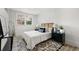 Stylishly decorated bedroom with a comfortable bed, modern decor, and bright natural light from windows at 2376 Cross Nw St, Atlanta, GA 30318