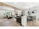 Open-concept kitchen with hardwood floors, seamlessly flowing into the living room, and a modern island at 2376 Cross Nw St, Atlanta, GA 30318
