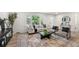Cozy living room featuring neutral decor, recessed lighting, and windows providing views of landscaped surroundings at 2376 Cross Nw St, Atlanta, GA 30318