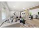 Spacious, bright living area seamlessly connected to kitchen, featuring hardwood floors and tasteful decor at 2376 Cross Nw St, Atlanta, GA 30318