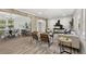 Bright, open-concept living room featuring a seamless flow into dining area, with hardwood floors and neutral tones at 2376 Cross Nw St, Atlanta, GA 30318