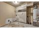 Unfinished basement featuring exposed ceiling pipes, concrete floors, and water heater at 3189 Glen Hollow Dr, Rex, GA 30273