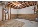 Unfinished basement with concrete floor and exposed ceiling at 3189 Glen Hollow Dr, Rex, GA 30273