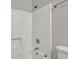 Bathroom with a combined shower and bathtub featuring white tiling surround at 3189 Glen Hollow Dr, Rex, GA 30273