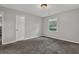 Comfortable bedroom with plush carpeting and a bright window providing a serene space to rest and unwind at 3189 Glen Hollow Dr, Rex, GA 30273